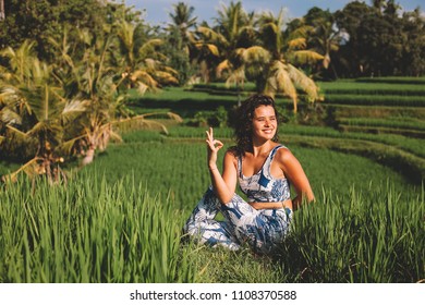 Young Woman Practice Yoga Outdoor In Rice Fields In The Morning During Wellness Retreat In Bali