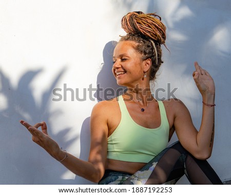 Young woman practicing Purna Matsyendrasana, Full Spinal Twist pose. Flexible spine. Hands in gyan mudra. Body care, healthy lifestyle. Support immune system.  Woman's profile. Yoga retreat. Close up. Stock fotó © 