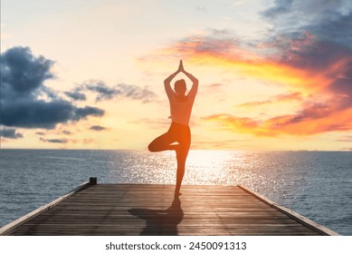 Young woman practicing yoga during yoga retreat in Asia, relaxation, exercise - Powered by Shutterstock