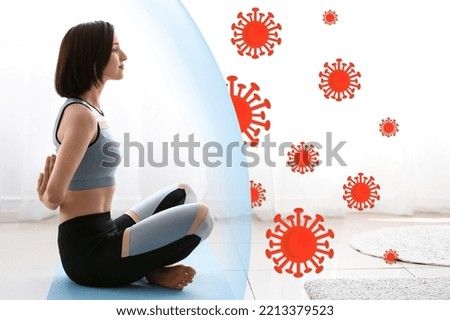Young woman practicing yoga at home. Concept of strong immunity