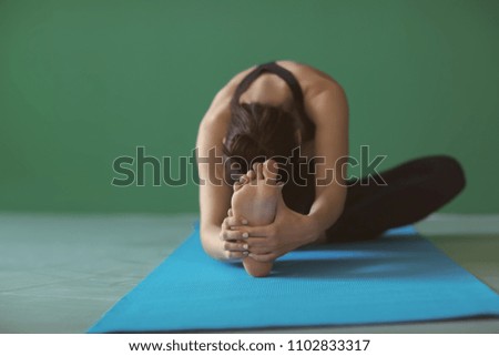 Similar – Image, Stock Photo Young woman stretching legs by sea pier