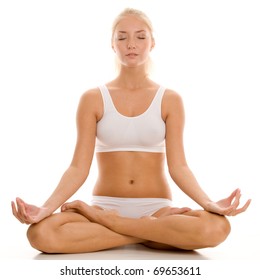 Young Woman Practicing Yoga In The Lotus Position