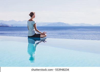 Young woman practicing yoga outdoors. Relaxation harmony lifestyle concept