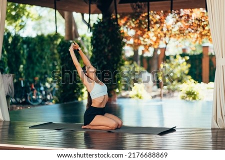 Young woman practicing yoga. Performs an exercise