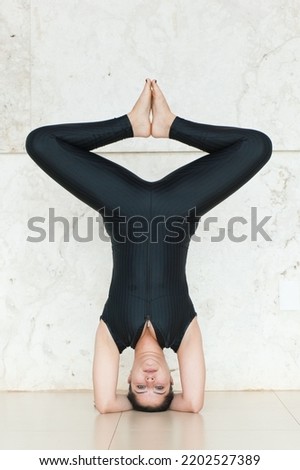 Young woman practicing yoga. Yoga pose, outdoor, indoor