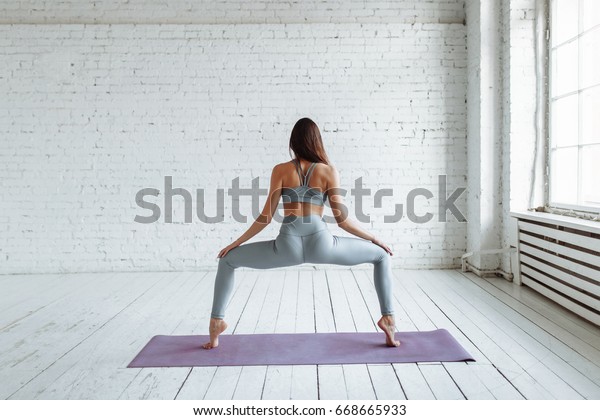 Young Woman Practicing Yoga Pose On Stock Photo Edit Now