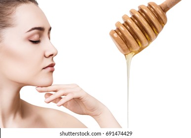 Young woman prepare for honey facial mask. - Powered by Shutterstock