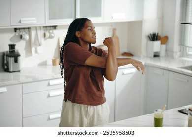 Young Woman Preparing Smoothie in Modern Kitchen - Powered by Shutterstock