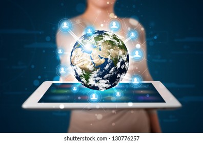 Young woman presenting 3d earth globe in modern tablet