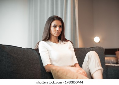 Young woman pretty relaxing on couch in living room. Casual style indoor shoot