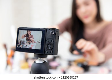 Young woman professional beauty vlogger or blogger recording cosmetic makeup tutorial with camera to share on social media - Shutterstock ID 1120880237