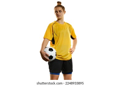 Young woman, professional female football, soccer player in yellow uniform posing with ball isolated over white studio background. Motivation. Concept of sport, action, competition, hobby, ad. - Powered by Shutterstock