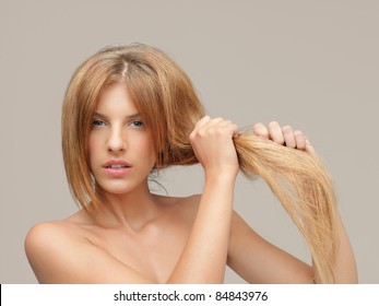 Young Woman Pulling Damaged Hair Both Hands