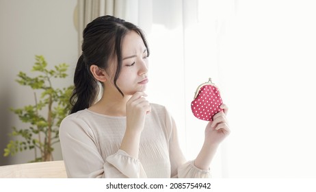 A Young Woman With A Purse.