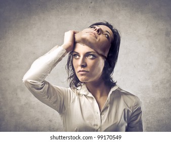 Young Woman Putting Off A Mask