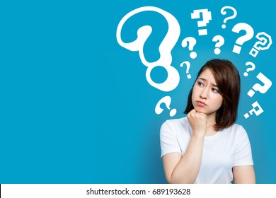 Young Woman With Question Marks.