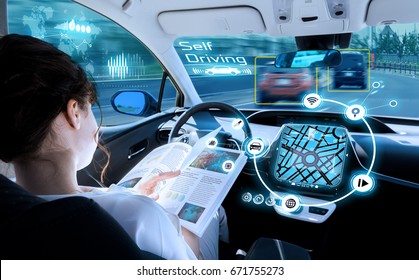 young woman reading a book in a autonomous car. driverless car. self driving vehicle. heads up display. automotive technology.
