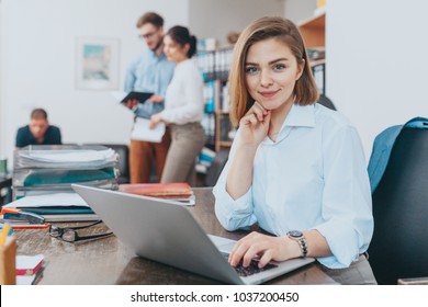 Young woman reading email at the office