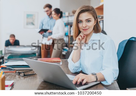 Young woman reading email at the office