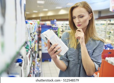 Young Woman Reading Label Milk