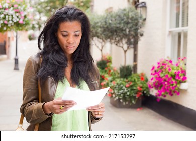 Young Woman Reading A Letter