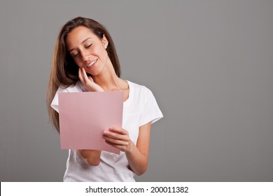 A Young Woman Reading A Love Letter