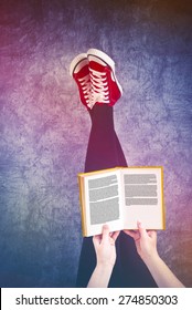 Young Woman Reading Pulp Fiction Book With Her Feet Raised In The Air, Generic Text On Pages