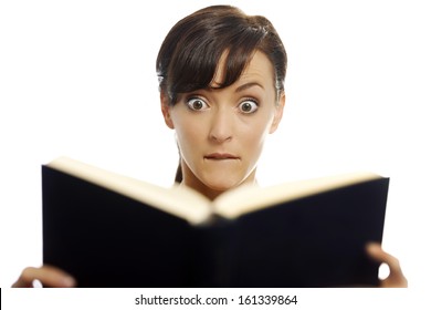 Young Woman Reading A Scary Book