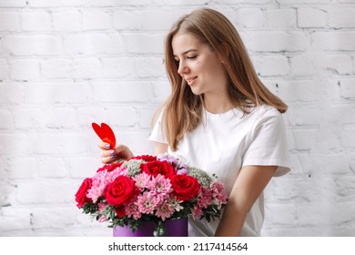  Young Woman Received Surprise Bouquet Of Flowers And Red Heart Card For Valentine's Day Over Break Wall Background. St. Valentine's Day, International Women's Day, Holiday,birthday 