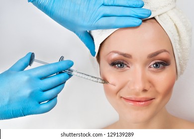 Young Woman Receiving A Botox Injection In Her Cheek
