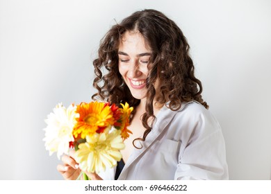 Young Woman Receiving A Bunch Of Flowers