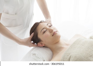 Young Woman Receiving A Head Massage