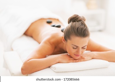 Young Woman Receiving Hot Stone Massage