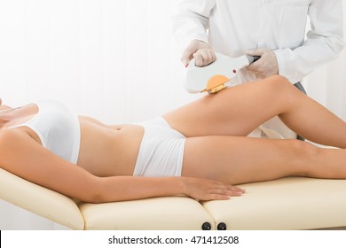 Young Woman Receiving Laser Epilation On Beauty Center