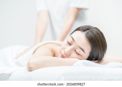 Young Woman Receiving A Massage At An Esthetic Salon