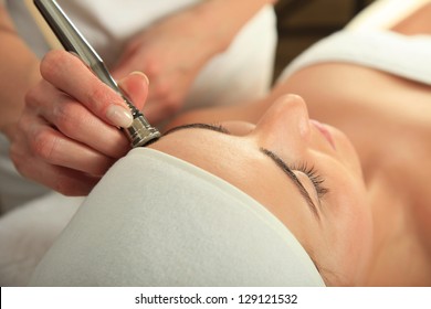 Young woman receiving massage  - microdermabrasion