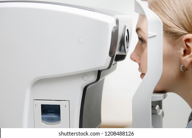 Young Woman Reception Doctor Ophthalmologist To Check Quality Of Eye Vision. Concept Diagnosis And Treatment Of Myopia, Hyperopia.