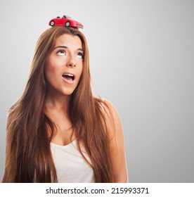 Young Woman With A Red Car Over His Head