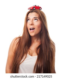 Young Woman With A Red Car Over His Head