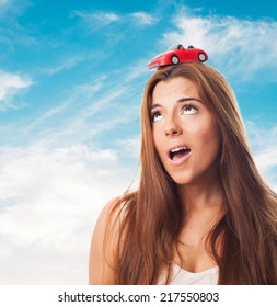 Young Woman With A Red Car Over His Head