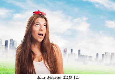 Young Woman With A Red Car Over His Head