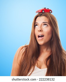 Young Woman With A Red Car Over His Head