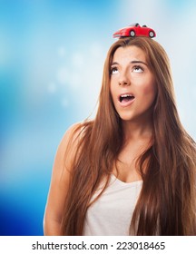 Young Woman With A Red Car Over His Head