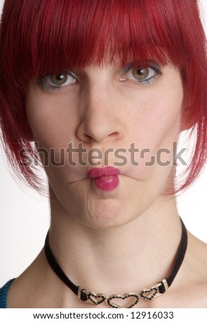 a young woman with red hair and kissmouth