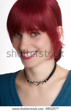 a young woman with red hair and smile