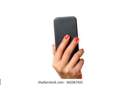 Young Woman With Red Painted Fingernails Holding A Mobile Phone In The Air With The Back Towards The Camera, Close Up Isolated On White