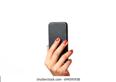 Young Woman With Red Painted Fingernails Holding A Mobile Phone In The Air With The Back Towards The Camera, Close Up Isolated On White