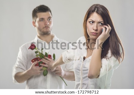 Young woman rejecting gifts from her boyfriend