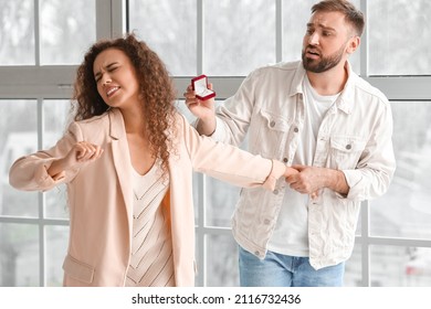 Young Woman Rejecting Marriage Proposal At Home