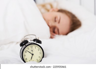 Young Woman Relaxing In Bed